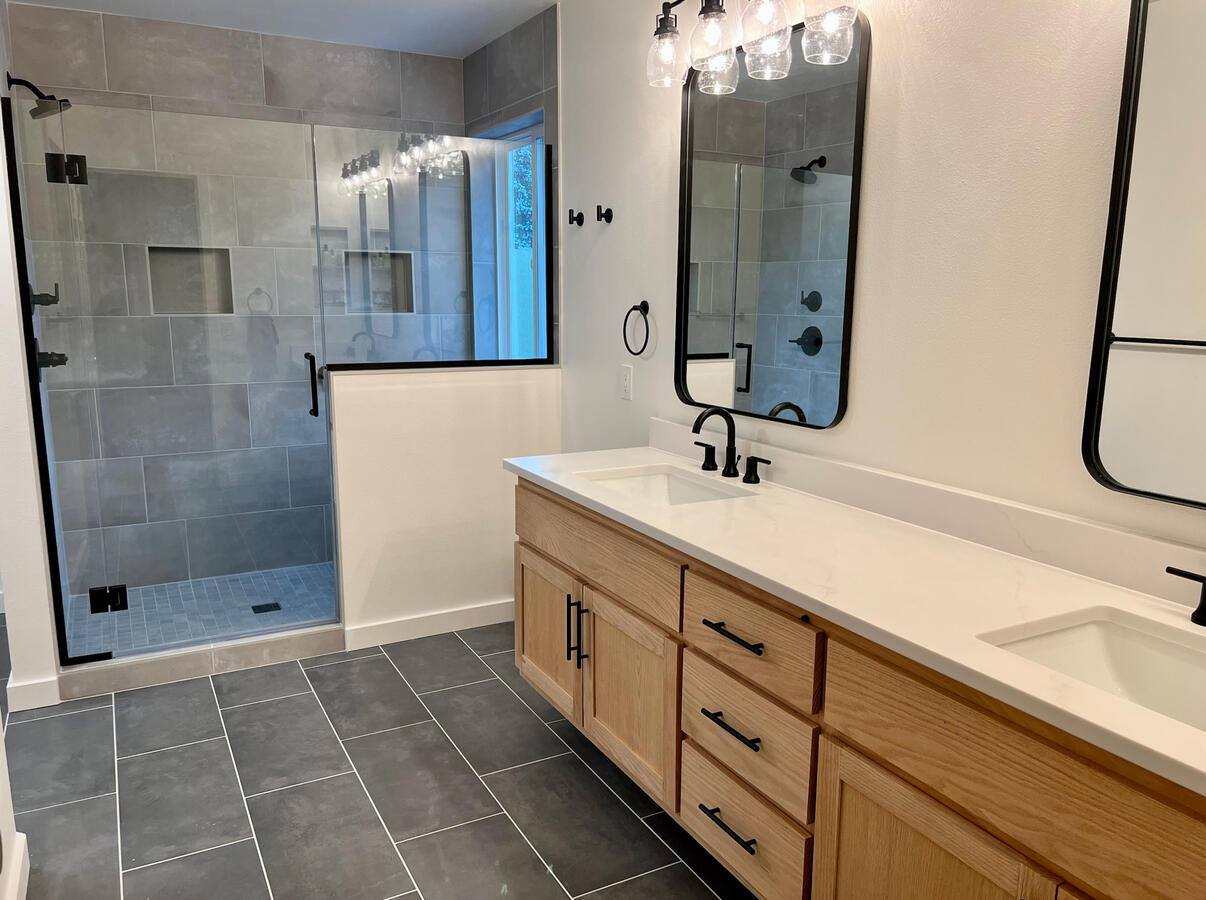 Full Bathroom Remodel Tile shower with glass door and eight foot oak vanity.
