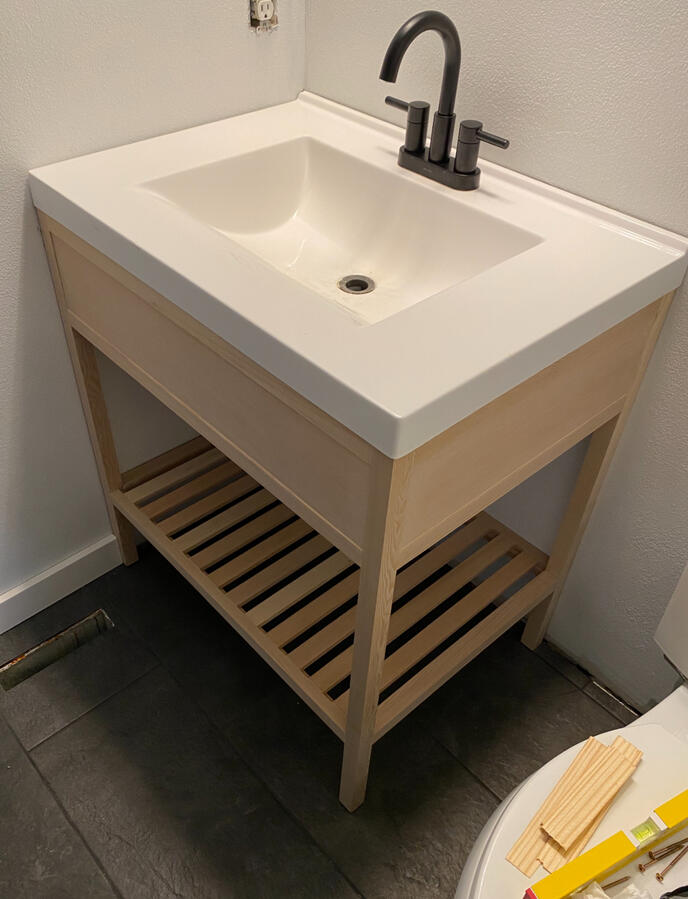 Newly Installed Single Sink Oak Vanity and New Tile Flooring Newly Installed Single Sink Oak Vanity and New Tile Flooring